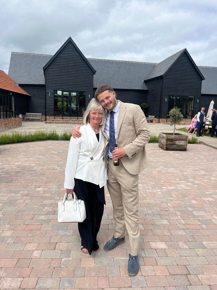 Ben and his mum, Patricia, dressed up at a wedding