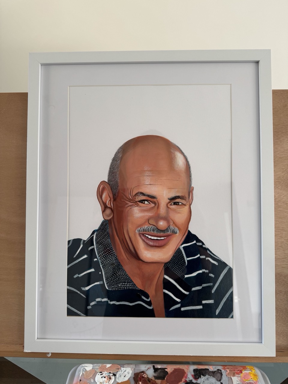 A commissioned realist portrait on canvas