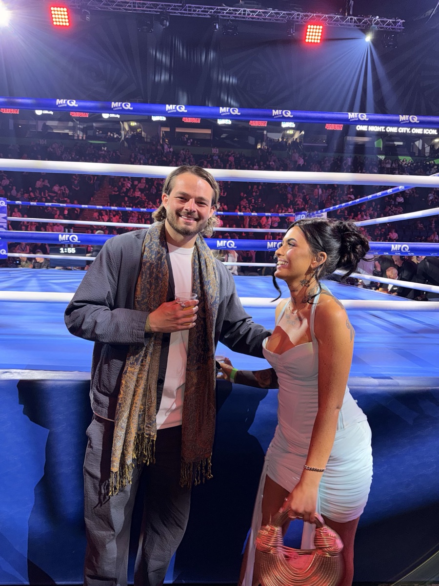 Ben and Niamh ringside at a boxing event, the two founders of Patricia Studios