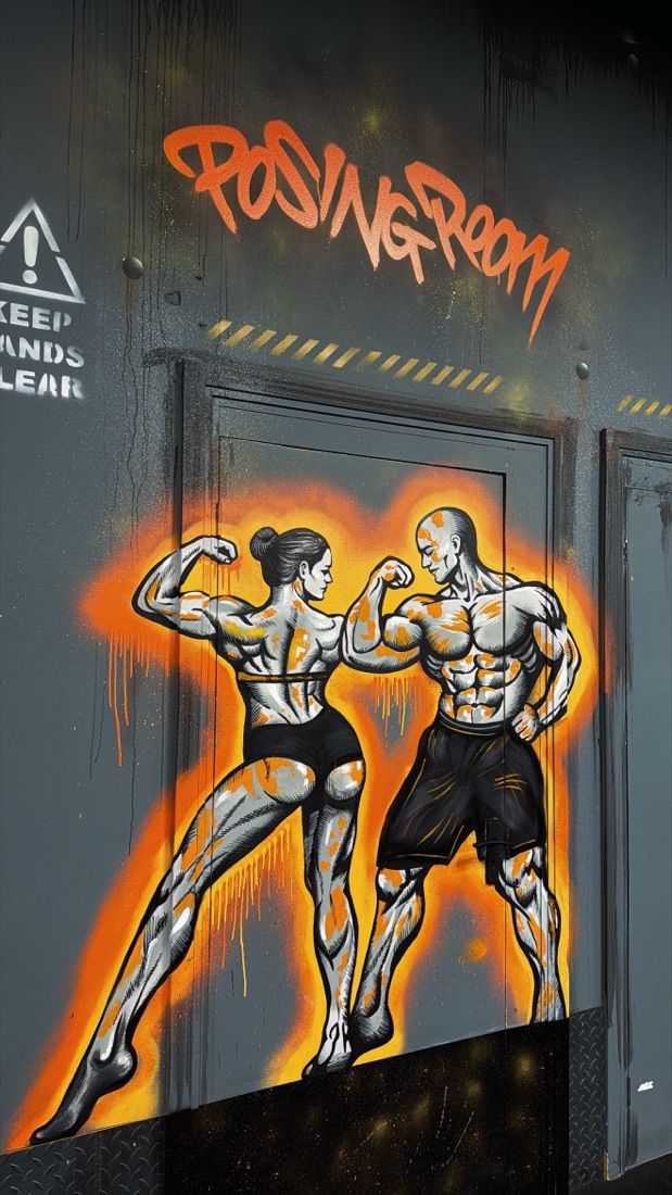 The Posing Room mural, two bodybuilders flexing either side of a doorway