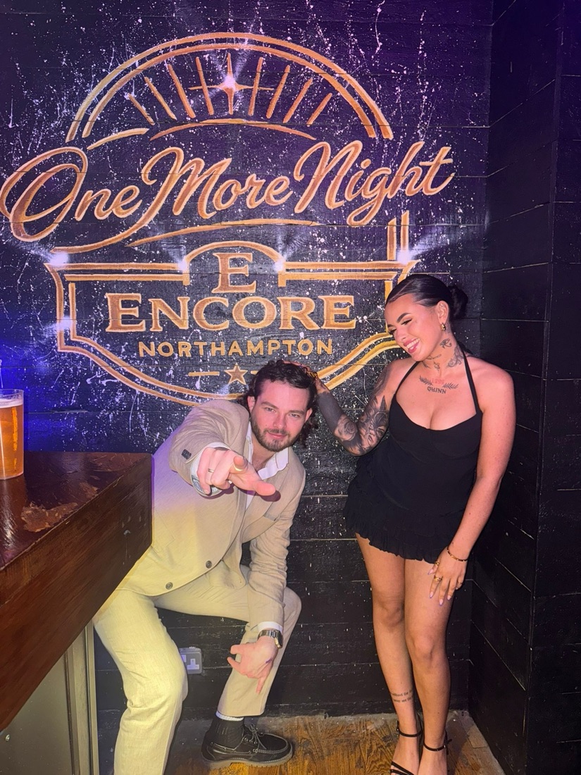 Ben and Niamh in front of the Encore 'One More Night' mural