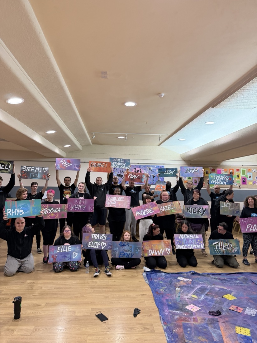 Born to Perform dancers holding up their hand-painted name boards