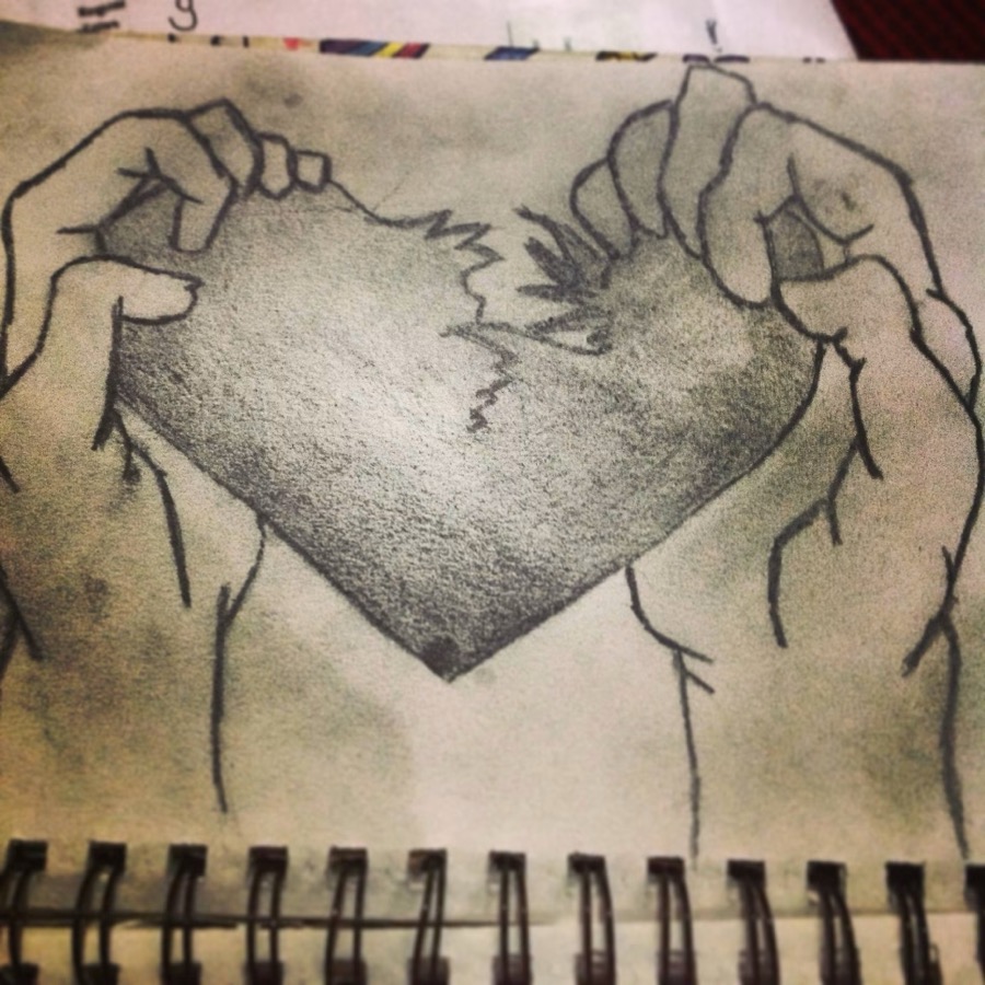 An early pencil drawing by Niamh, two hands breaking a heart