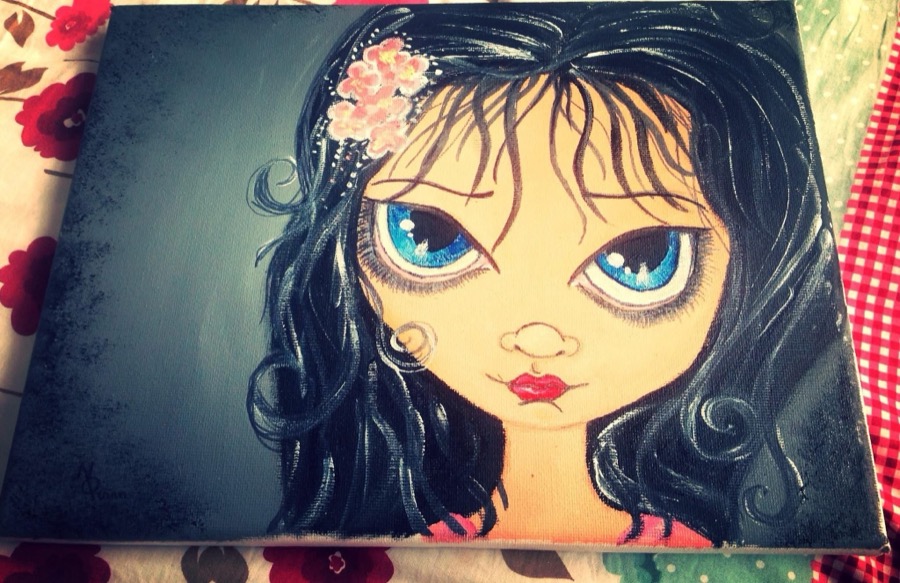 An early canvas painting by Niamh, a girl with big blue eyes and dark curly hair