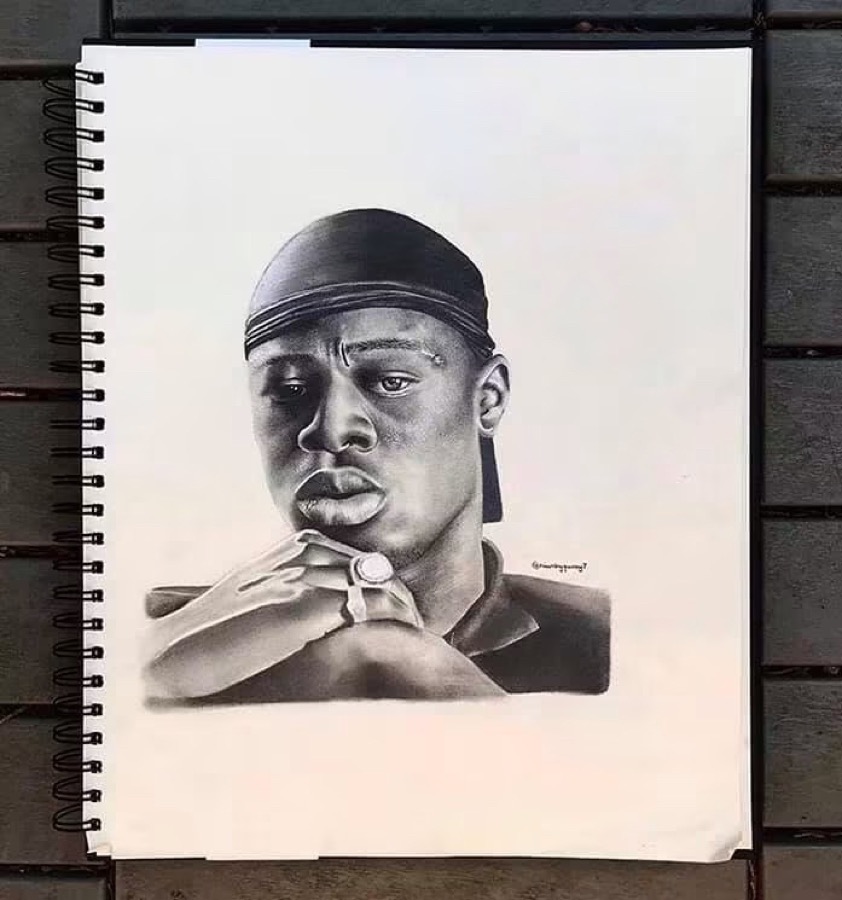 A hyper-realistic pencil portrait by Niamh of a young man
